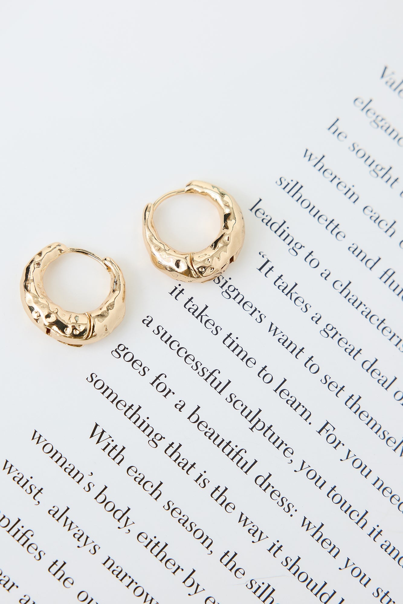 About Business Earrings Gold